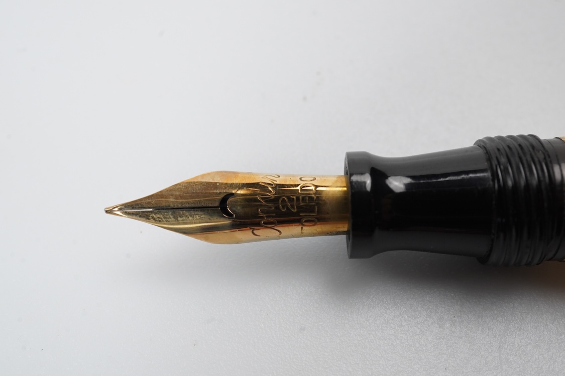 A Conklin ring top hand engraved crescent filler fountain pen with 14ct. gold Conklin flexible nib